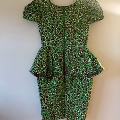 This Stunning Authentic Hand Made African Dress In Vibrant Green And Magenta Print Is Straight From Nigeria. Featuring A Split Peplum Waist, Generous Exposed Zipper, Vent For Ease Of Wear, Lining, And Bust Padding. My Husband Is Nigerian And My Sweet Mother In Law Gifted Me This Dress The Last Time She Came To Visit. I Absolutely Love The Style And The Vibrant Green Print! Unfortunately, Though, I Am Very Long And Lanky And This Dress Proved To Be Very Ill Fitting For My Height...Beyond The Abil Multicolor Peplum Dress For Party, Multicolor Fitted Peplum Dress, Green Short Sleeve Cocktail Dress, Fitted Floral Print Peplum Dress, Green Peplum Party Dress, Custom Made Dress, Cowl Dress, Made Dress, Disco Dress