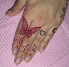 a woman's hand with tattoos on it