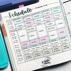 an open planner sitting on top of a table