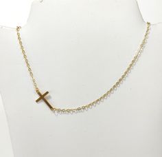 Cross gold steel necklace, Layering jewelry, Religion cross choker, Gold necklace, Minimalist jewelry, Dainty cross choker, Tiny necklace Beautiful simple necklace with gold stainless steel cross and steel chain. Simple choker or everyday wear Length 42cm  The necklace will be delivered inside a craft jewelry box. JEWELRY CARE: Please take care of your jewelry do not wear in the shower, swimming pool, or to bed. Keep away from harsh chemicals and cleaners. It is always best to put on your jewelr Minimalist Cross Chain Necklace With Delicate Chain, Minimalist Delicate Chain Cross Necklace, Minimalist Gold Crucifix Jewelry, Minimalist Crucifix Jewelry With Delicate Chain, Minimalist Clavicle Cross Chain Jewelry, Simple Clavicle Chain Cross Jewelry, Minimalist Gold Chain Necklace With Cross Pendant, Adjustable Gold Cross Pendant Necklace, Simple Cross Clavicle Chain Jewelry