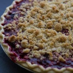 a pie with crumbs on it sitting on a table