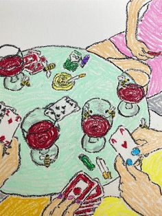 a child's drawing of playing cards on a table with other items around it