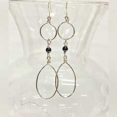 Elevate Your Style With These Exquisite Handmade Dangle Statement Earrings. Handcrafted With Silver Tone Tarnish-Resistant Jewelry Wire And Adorned With Genuine Hematite Beads, They Exude Elegance And Sophistication. Suspended From Sterling Silver French Hook Ear Wires, They Offer Both Style And Comfort. Hematite, Known For Its Healing Properties And Ability To Ward Off Negative Energies, Adds A Unique Touch. Associated With The Root Chakra, These Earrings Promote Grounding, Security, And Safety Modern Silver Teardrop Chandelier Earrings, Silver Metal Teardrop Earrings Wire Wrapped, Silver Metal Wire Wrapped Teardrop Earrings, Silver Wire Wrapped Metal Teardrop Earrings, Silver Teardrop Wire Wrapped Chandelier Earrings, Silver Wire-wrapped Dangle Linear Earrings, Silver Wire Wrapped Dangle Linear Earrings, Silver Wire Wrapped Long Drop Teardrop Earrings, Modern Silver Wire Wrapped Hoop Earrings