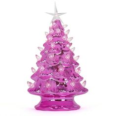 a purple glass christmas tree on a white background