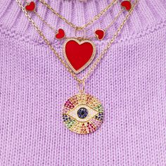 This necklace charm features a diamond evil eye on a gemstone decorated medallion. This charm is the perfect way to add some sparkle to any necklace! It looks amazing worn with our smaller version. Rainbow Metal, Diamond Evil Eye, Evil Eye Necklace, Eye Necklace, Multi Stone, Evil Eye, Gemstone Colors, Blue Sapphire, Charm Necklace