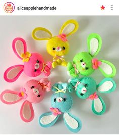 several small stuffed animals in different colors and sizes