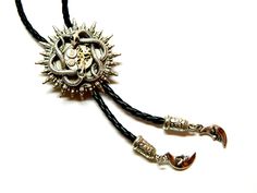 "Sun Steampunk Bolo Tie Snakes, silver or golden, with green emerald eyes, honeymoon surprise, bola fashion silver steam punk accessory clockwork, unique birthday gift mens jewelry. Black leatherette cord and moon metal pendants. Unique birthday gift, honeymoon surprise, wedding, Valentine's Day, Father's Day. Size of about 1 1/2\" / 4 cm diameter of the solar disk Length of the cord 40\" / 100 cm (including metal pendants) Made to order! more Bolo ties: https://www.etsy.com/shop/EmilySteampunk? Adjustable Metal Sun And Moon Jewelry, Adjustable Jewelry With Sun And Moon Design For Gift, Adjustable Sun And Moon Design Jewelry For Gifts, Fantasy Engraved Jewelry For Fantasy Events, Silver Sun And Moon Festival Jewelry, Silver Engraved Jewelry For Costume Events, Adjustable Gothic Gold Jewelry, Adjustable Fantasy Festival Jewelry, Adjustable Fantasy Jewelry For Festivals