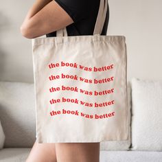 a woman carrying a book bag with the words, the book was better than the book was better