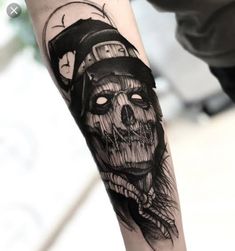 a skull with a hat on it's head is shown in this tattoo design