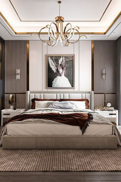 a bedroom with a large bed and a chandelier hanging from it's ceiling