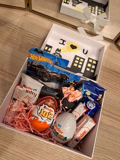 an open gift box filled with candy and candies