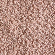 closeup view of the texture of a carpet with pink and white colors, as seen from above