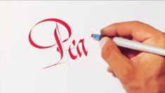 a person writing the word pia with a pencil