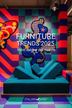 a blue couch sitting in front of a colorful wall with the words furniture trend's 205