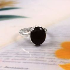 Center Gemstone : Black onyx  Material : Gemstone Ring Gemstone Creation : Natural Gemstone Shape : oval Metal : 925 Sterling Silver Black Birthstone Ring Gift, Black Birthstone Rings For Gifts, Black Opal Cabochon Ring As Gift, Black Opal Ring With Cabochon As A Gift, Black Cabochon Ring As A Gift, Black Cabochon Ring For Gift, Black Opal Gemstone Ring, Elegant Black Opal Ring Gift, Elegant Black Opal Ring For Gift