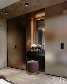 a bedroom with a mirror, stool and flowers on the table in front of it