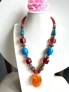 This beautiful and vintage style Tibetan handmade necklace with pendent is made from Amber resin and coral with Tibetan silver. This beautiful necklace is 21"inches long and made in Nepal by skilled artisan. Great piece to add your jewelry collection from Asia.Thanks Tibetan Beads Jewelry, Tibetan Jewelry Boho, Tibetan Necklace Bohemian, Amber Resin, Bohemian Hand-strung Red Coral Necklaces, Artisan Hand-strung Red Coral Necklace, Wedding Jewellery Necklace, Tibet, Nepal