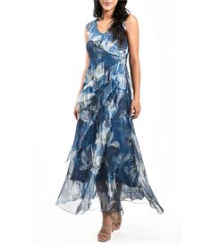 Komarov Sleeveless Ruffled V-Neck Chiffon Maxi Dress | Dillard's Summer V-neck Chiffon Dress With Pleated Bodice, Chiffon Sleeveless Dress With Ruffles For Evening, Summer Sleeveless Silk Chiffon Dress, Blue Sleeveless Silk Chiffon Dress, Elegant Sleeveless Chiffon Dress With Ruffles, Sleeveless Silk Chiffon Dress For Summer, Fitted V-neck Silk Chiffon Dress, Elegant Chiffon Dress With Ruffles In Georgette, Chic Sleeveless Georgette Dress