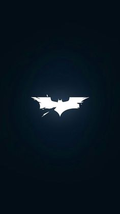 the dark knight rises logo in batman's bat symbol, which appears to be white