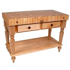 a butcher block table with two drawers on one side and an open drawer on the other