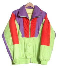 Vintage C&A Rodeo ski jacket from the 1980's. Retro look in a neon green, purple and red colour. Zip front concealed and three front pockets. Elasticated waist and cuffs. Made in Italy from a nylon fabric with padded inside lining.  Condition: Excellent vintage condition. Chest: 46in Length: 28in Inside sleeve: 20in More vintage clothing on our website www,brickvintage.com Ski Vintage, Red Colour, Nylon Fabric, Retro Look, Ski Jacket, Neon Green, Rodeo, Vintage Clothing, Skiing