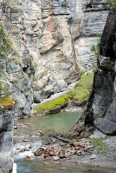 a river flowing between two large rocks