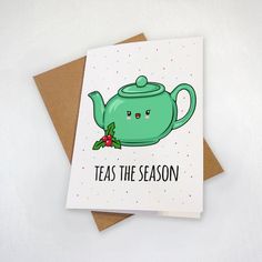 a card with a green teapot on it that says teas the season