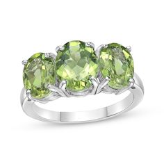 Whether it celebrates an August birthday or just a favorite color, this spring-green peridot ring will be an everyday favorite. Fashioned in sterling silver The center 9mm x 7mm oval-cut peridot is flanked by two slightly smaller ones in this fun three-stone design Gold Layered Bracelets, Pearl Diamond Jewelry, Cross Jewelry Necklace, 3 Stone Ring, Fan Jewelry, August Birthday, 3 Stone Rings, Three Stone Ring, Peridot Ring