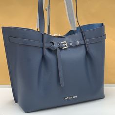 Michael Kors Outlet Emilia Large Pebbled Leather Tote Bag Color Navy Nwt Authentic Our Coveted Emilia Tote Bag Features A Belted Silhouette That Will Add A Sleek Sophistication To Your Wardrobe. Sized To Hold All Your Essentials, Plus A Tablet Or Notebook, It’s Made From Pebbled Leather And Finished With Slim Top Handles. We Think It’s Great For Work, Play And Everything In Between. Tote Bag Leather 100% Leather Silver-Tone Hardware 16.75”W X 11.5”H X 8.5”D Handle Drop: 11.25” Compatible With 13 Michael Kors Leather Shoulder Bag With Palladium Hardware, Blue Leather Bags With Branded Hardware, Michael Kors Leather Bags With Silver-tone Hardware, Michael Kors Soft Leather Bags For Office, Michael Kors Textured Leather Office Bag, Michael Kors Leather Shoulder Bag With Silver-tone Hardware, Blue Leather Shoulder Bag With Palladium Hardware, Modern Blue Michael Kors Bags, Michael Kors Everyday Bag With Silver-tone Hardware