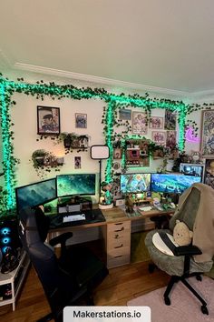 a room with two computer desks and many pictures on the wall above them, all decorated in green string lights