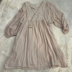 New Without Tags, Never Been Worn. Size Small But Runs Big Brown Cottagecore Dress For Summer, Bohemian Beige Mini Dress For Brunch, Beige Bohemian Mini Dress For Brunch, Bohemian Beige Mini Dress For Day Out, Beige Flowy Boho Dress Casual Style, Casual Flowy Beige Boho Dress, Casual Beige Flowy Boho Dress, Beige Cotton Mini Dress With Lace Trim, Cute Beige Cotton Mini Dress