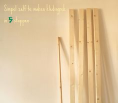 some wood sticks are next to a wall with the words simple self - made kreae in it