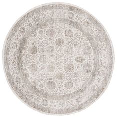 a round rug with an ornate design in grey and white colors on a white background