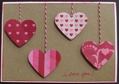 valentine's day card with hearts hanging from twine