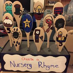 wooden spoons with cartoon characters on them are for nursery rhyme students to use