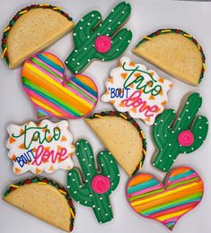 decorated cookies in the shape of cactus, heart, and taco