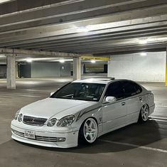 a white car parked in a parking garage