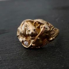 Absolutely love this antique Edwardian gold fill ring. Two tigers I believe getting ready to mate circle each other. A genuiune diamond has replaced a ruby that was originally with the ring. Currently this ring is a size 10, It may fit a tiny bit smaller like a size 9.5. Gold looks really imaculent on this ring, it really looks like solid gold. Ring is unmarked and there is a tiny bend on the piece on the back see pics. I have molded this ring to fabricate in gold. This is a great ring for the p Two Tigers, Tiger Ring, Ring Antique, Gold Filled Ring, Antique Rings, Statement Ring, Rings Statement, Gold Ring, Women Rings