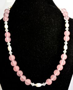 Lovely Pink tones of the Rose Quartz mixed with Freshwater Purls and a bit of Bling with the added Crystals that catch the light and sparkle. Beaded single strand necklace jewelry designed and created in our home. all nickle free findings.  Quartz beads are 10 mm. 20" in length. Hand-strung Pink Rose Quartz Necklace, Beaded Rose, Necklace Ideas, Pink Beaded, Stone Beaded Necklace, Rose Quartz Beads, Pink Necklace, Quartz Beads, Jewelry Design Necklace