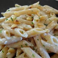 pasta with white sauce and parsley on top