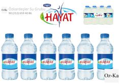 six bottles of water are shown with the same label as each one is labeled in thai