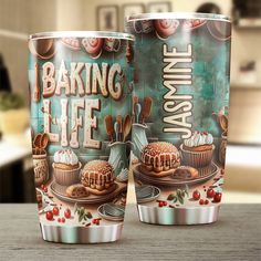 two cups sitting on top of a wooden table next to each other with the words baking life printed on them