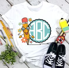 a t - shirt with an image of a pencil and flowers on it