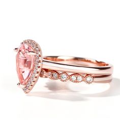 two rose gold wedding rings with an oval cut pink morganite and diamond band set