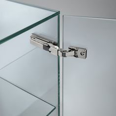 a close up of a glass door with a hinge on it's side