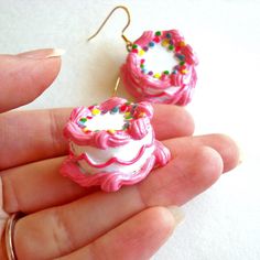 These earrings are bold, girly, and so fun! Whether it's actually your birthday or not, these earrings make everyday feel like a party. These earrings were designed and handmade by me, the main focus is the large birthday cake pendants with all the fun and kitschy details of those classic birthday cakes we all remember as kids: vanilla cake with lots of piped pink icing, lacy hot pink icing piped along the center and topped with bright rainbow sprinkles. The cakes hang below your choice of surgi Handmade Polymer Clay Jewelry For Birthday, Pink Jewelry With Matching Earrings For Birthday, Birthday Dangle Earrings Made Of Polymer Clay, Pink Polymer Clay Birthday Earrings, Birthday Polymer Clay Dangle Earrings, Cute Pink Jewelry For Birthday, Pink Polymer Clay Earrings For Birthday, Sweet Handmade Party Earrings, Pink Drop Earrings For Birthday