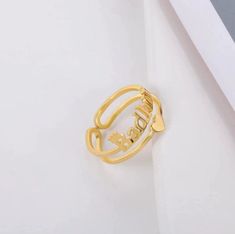 a gold ring with the word love on it