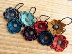 Make a statement in the show pen or on the ranch with a leather flower for your hair! These feature your choice of leather and concho color on a black elastic replaceable hair tie. Available in too many colors to list. Please PM me with what color family you're looking for and I can send current available options. Wholesale discounts available! Leather Accessories Diy, Flower Hair Tie, Art Du Cuir, Leather Hair Accessories, Handmade Leather Jewelry, Leather Accessories Handmade, Leather Jewels, Leather Jewelry Diy