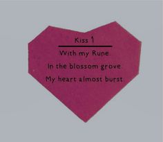 a piece of paper with the words kiss 1 written in black ink on it, and an image of a pink heart