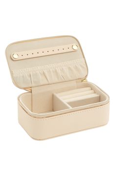 an open white box with compartments on the inside